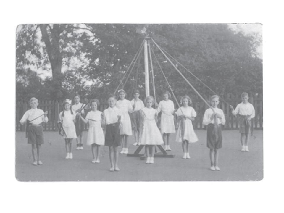 Leeming Bar School Children standing by the May Pole.